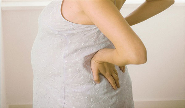 Боли в пояснице при беременности во втором триместре
